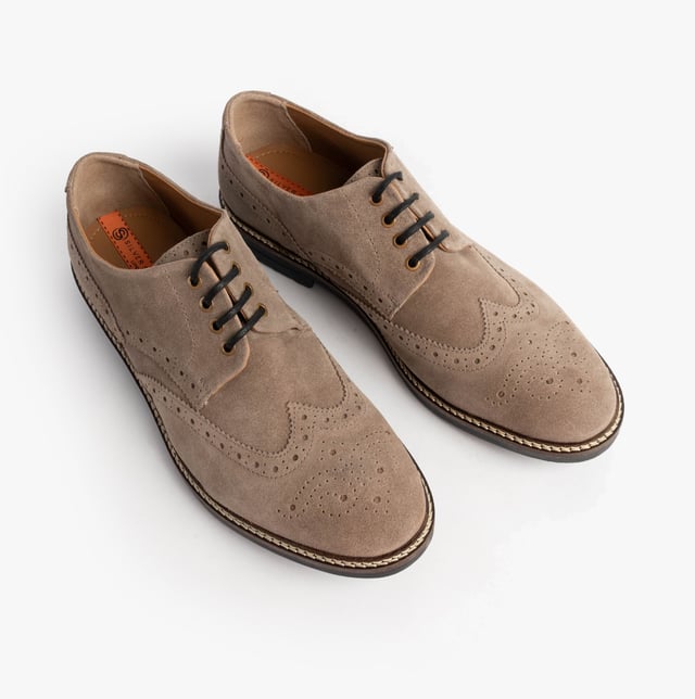 These beige brogue shoes feature a suede upper, textile lining, rubber sole, and lace-up closure. Designed for comfort, they are suitable for formal occasions and low-top style