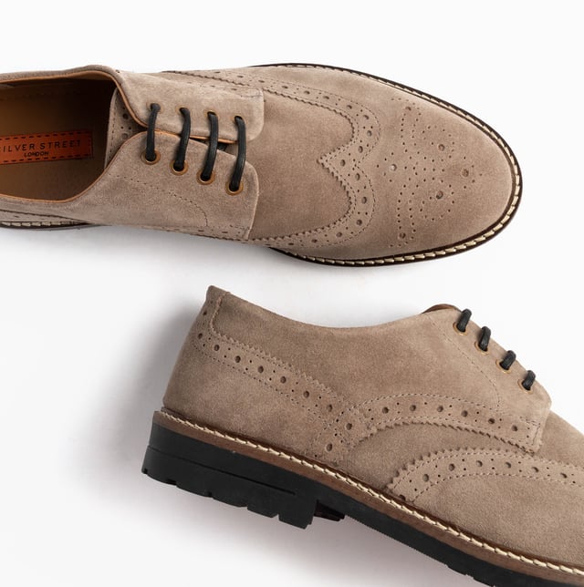 These beige brogue shoes feature a suede upper, textile lining, rubber sole, and lace-up closure. Designed for comfort, they are suitable for formal occasions and low-top style
