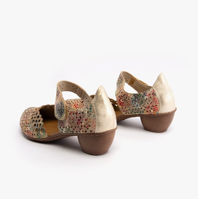 These Mary Jane shoes feature coated leather, synthetic lining, and a RIRICON sole with a low block heel. Designed for comfort and breathability, ideal for casual wear