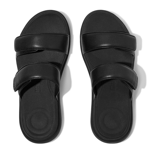 These slip-on women's slides feature a leather upper and lining, EVA sole, and wedge heel for comfort and breathability, ideal for casual wear
