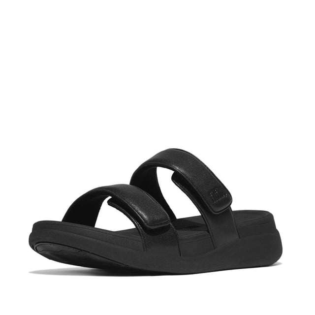 These slip-on women's slides feature a leather upper and lining, EVA sole, and wedge heel for comfort and breathability, ideal for casual wear
