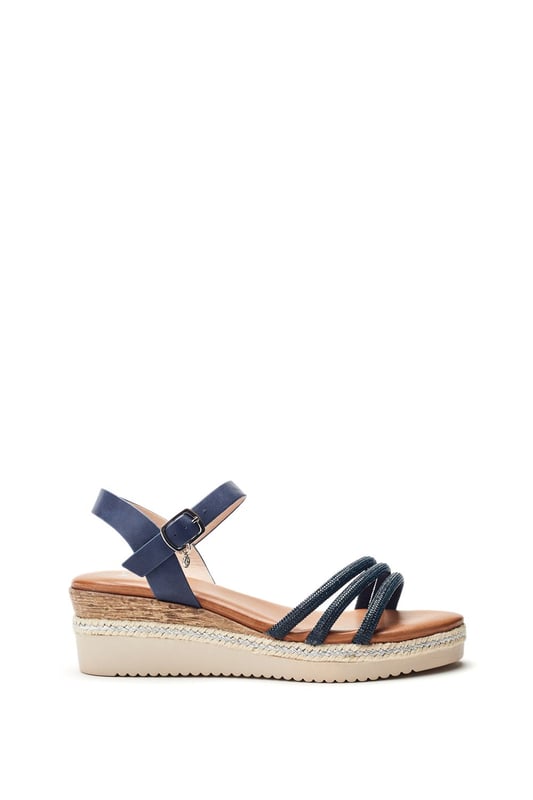 Keep it cool in Kandace. This strappy sandal features a cork heel cover with plaited trim detailing, perfect for your next holiday in the sun.