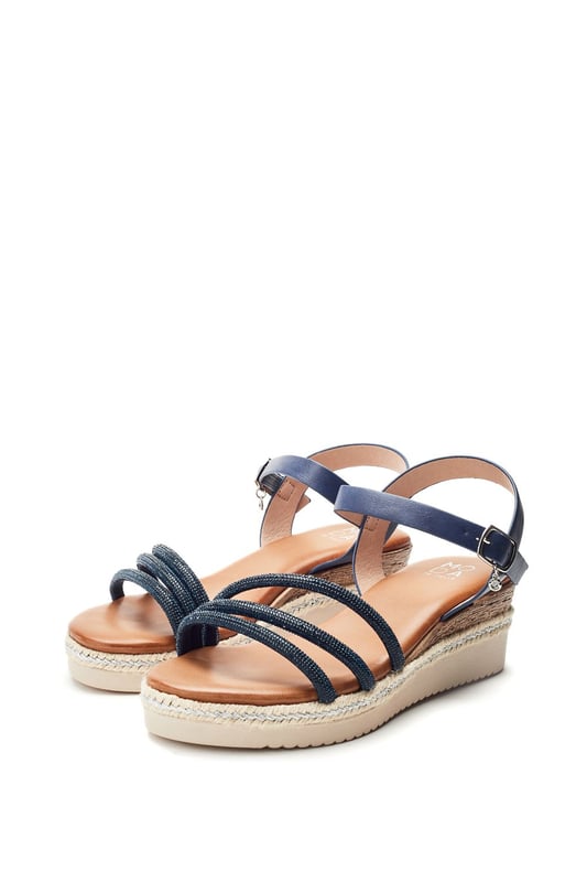 Keep it cool in Kandace. This strappy sandal features a cork heel cover with plaited trim detailing, perfect for your next holiday in the sun.