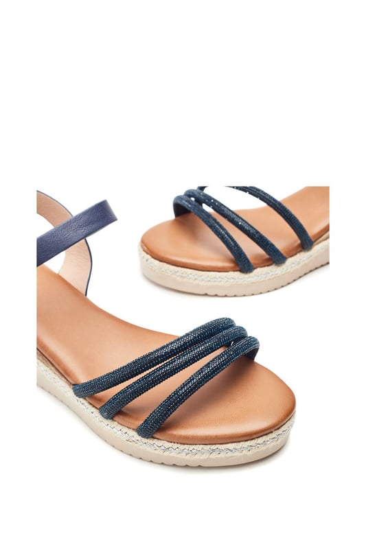 Keep it cool in Kandace. This strappy sandal features a cork heel cover with plaited trim detailing, perfect for your next holiday in the sun.