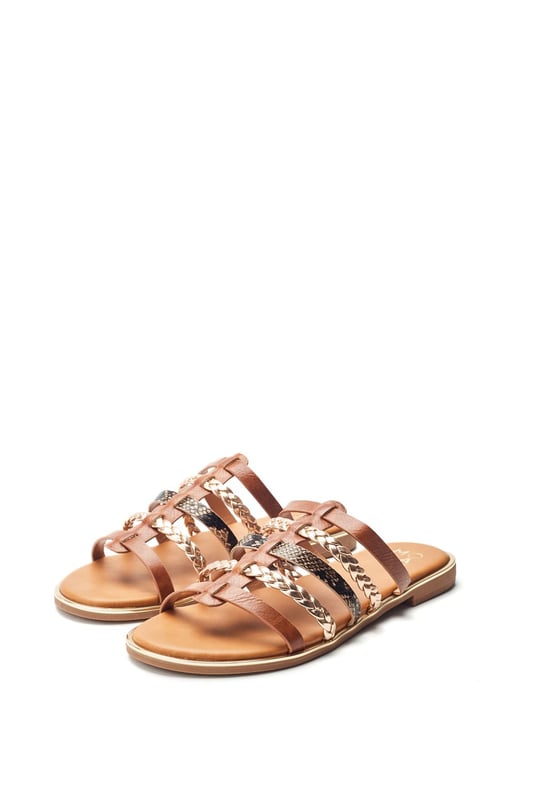Introducing Junie, the essential flat for the summer season. This slip-on style features a front strap design with leather lining to ensure you feel as good as you look.