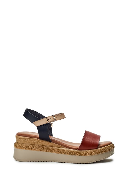 Keep your feet cool this season with Nyx, a low wedge heeled sandal that offers the perfect blend of classic sandals style and cool comfort. Complete with metallic buckle detailing and an easy to wear wedge, this style embodies both fashion and practicality.