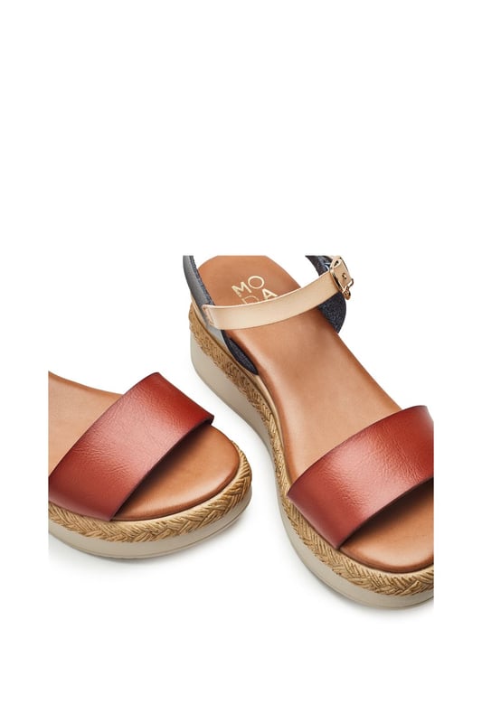 Keep your feet cool this season with Nyx, a low wedge heeled sandal that offers the perfect blend of classic sandals style and cool comfort. Complete with metallic buckle detailing and an easy to wear wedge, this style embodies both fashion and practicality.