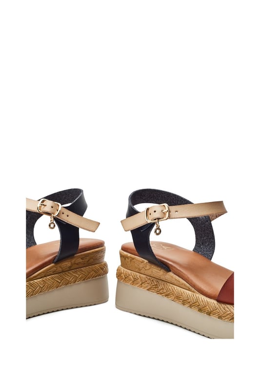 Keep your feet cool this season with Nyx, a low wedge heeled sandal that offers the perfect blend of classic sandals style and cool comfort. Complete with metallic buckle detailing and an easy to wear wedge, this style embodies both fashion and practicality.