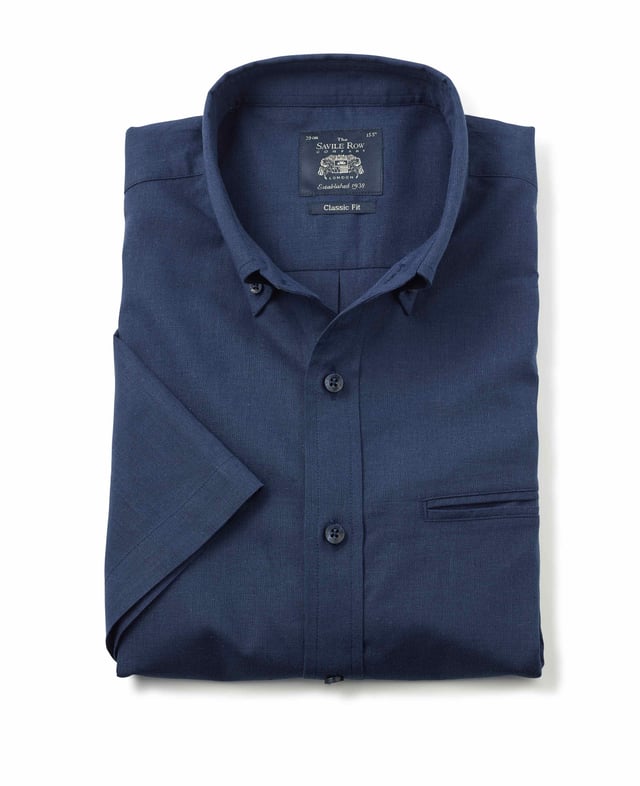 This short-sleeved shirt is cut from a cotton-linen blend fabric that's really light and breathable. Ideal for warm weather, it's cut for a comfortable fit and has classic details like a button-down collar and chest pocket. 55% linen / 45% cotton. Blending the cotton with linen gives a less crumpled look than pure linen. Generously proportioned classic fit. Split yoke, long tails, chest pocket. Floral trim in back neck. Single welt pocket on chest.