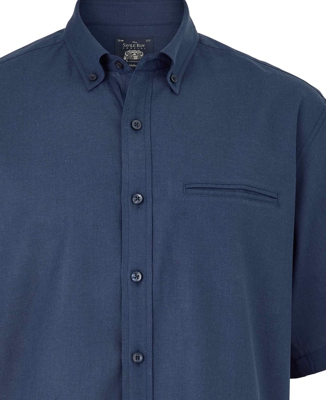 This short-sleeved shirt is cut from a cotton-linen blend fabric that's really light and breathable. Ideal for warm weather, it's cut for a comfortable fit and has classic details like a button-down collar and chest pocket. 55% linen / 45% cotton. Blending the cotton with linen gives a less crumpled look than pure linen. Generously proportioned classic fit. Split yoke, long tails, chest pocket. Floral trim in back neck. Single welt pocket on chest.