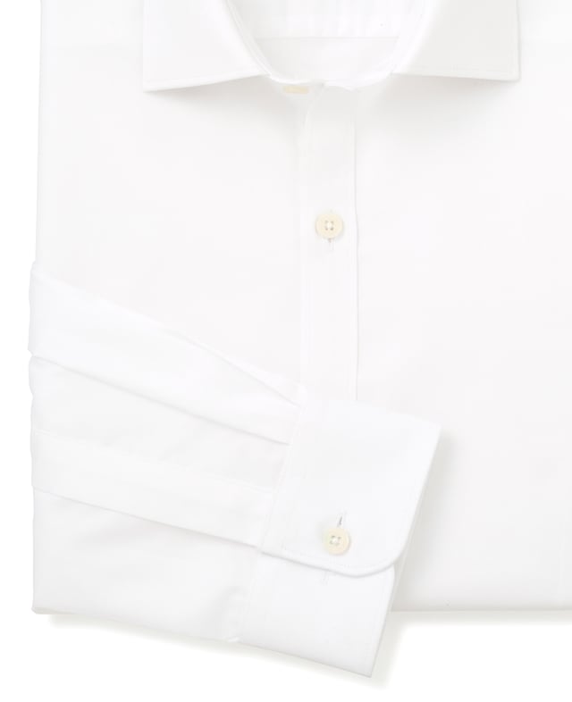 Cut to our most tailored fit, this extra slim white shirt will become the foundation of your favourite ensembles. It's made from soft cotton and finished with a curl-resistant collar and single cuffs. 100% BCI cotton twill; smooth and supple with a silk protein easy-care finish. Our slimmest fit, skimming the body. Curl resistant cutaway collar, with an integral and removable collar stay. Pucker-free french taped armhole seams. Single cuff. Split yoke, two back darts. Shirt is presented in fully recyclable packaging.