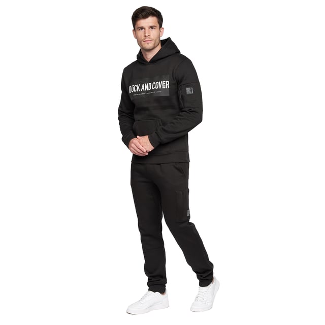 Gewebe: Baumwolltwill, mit Fleece-Innenfutter. Design: Abzeichen, bestickt, Logo. DTM-Ösen. Taille: DTM Tunnelzug, Elastisch, gerippt. Taschenart: Zwei Seitentaschen, 1 Tasche unten, Reißverschluss.