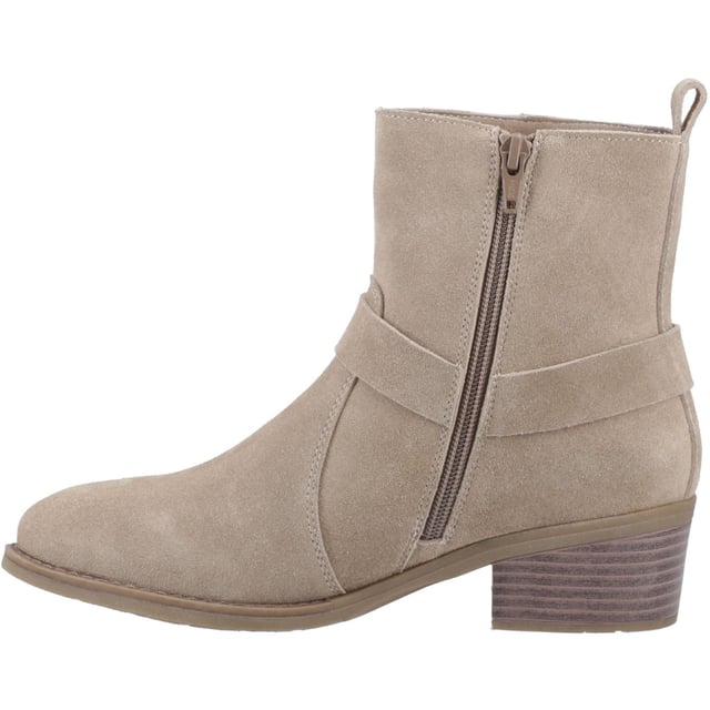 Hush Puppies Iria Suede Women's Taupe Heeled Ankle Boots Kick up your style with the Iria Boot! Real suede, a chic Western buckle, and a comfy block heel make it perfect for nailing the cowboy trend. These ankle boots are made for all-day adventures with our WorryFree water repellent protection.