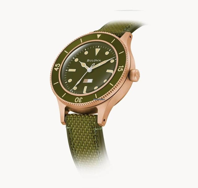This Bulova Archive Series Mil Ships 150th Anniversary Edition Analogue Watch for Men is the perfect timepiece to wear or to gift. It's Bronze 41 mm Round case combined with the comfortable Green Silicone watch band will ensure you enjoy this stunning timepiece without any compromise. Operated by a high quality Quartz movement and water resistant to 20 bars, your watch will keep ticking. Honoring Bulova’s military legacy and a rare 1957 U.S. Navy prototype, the Special Edition MIL-SHIPS Bronze celebrates Bulova’s 150th Anniversary. This Analogue watch is equipped with a Luminous Hands and a Screw Down Crown High quality Green Silicone strap, measuring 21 cm in length and 18 mm in width, with a Buckle. Case diameter: 41 mm,case thickness: 14 mm, case colour: Bronze and dial colour: Green