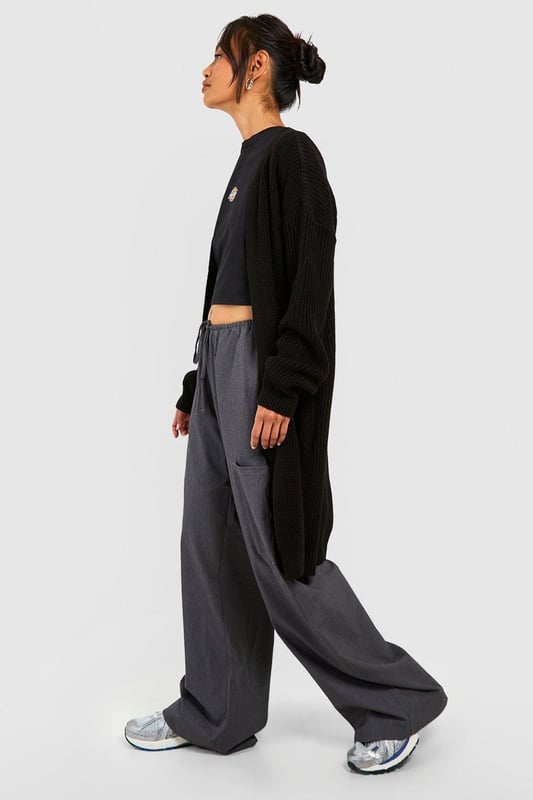 Oversized boyfriend fit for a relaxed, effortless look
        Edge-to-edge design with no fastenings for easy layering
        Chunky knit texture adds depth and warmth
        V-neckline enhances the casual, laid-back vibe
        Long sleeves with ribbed cuffs for a cosy finish
    
    Embrace the casual-cool aesthetic with this Fisherman Edge To Edge Boyfriend Cardigan from Boohoo. Perfect for those who love to blend comfort with style, this oversized piece is a versatile addition to any wardrobe. Layer it over a crop top and wide-leg trousers for an on-trend look that's ideal for coffee dates or casual outings. The chunky knit texture not only provides warmth but also adds an interesting visual element to your ensemble. For a more polished appearance, pair it with a fitted dress and ankle boots. This cardigan is your go-to for creating effortlessly chic outfits, whether you're heading to a family gathering or a relaxed day out with friends. Its adaptable nature makes it a staple for the fashion-forward woman who values both style and comfort in her everyday wear.