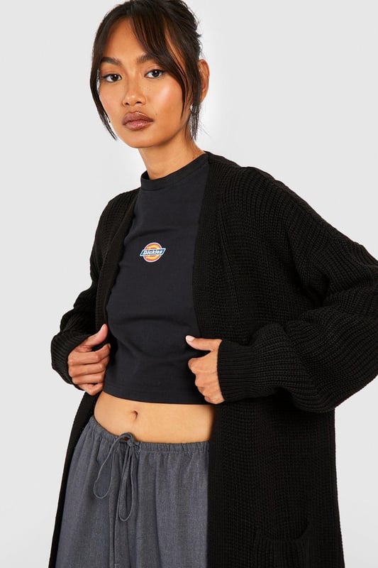 Oversized boyfriend fit for a relaxed, effortless look
        Edge-to-edge design with no fastenings for easy layering
        Chunky knit texture adds depth and warmth
        V-neckline enhances the casual, laid-back vibe
        Long sleeves with ribbed cuffs for a cosy finish
    
    Embrace the casual-cool aesthetic with this Fisherman Edge To Edge Boyfriend Cardigan from Boohoo. Perfect for those who love to blend comfort with style, this oversized piece is a versatile addition to any wardrobe. Layer it over a crop top and wide-leg trousers for an on-trend look that's ideal for coffee dates or casual outings. The chunky knit texture not only provides warmth but also adds an interesting visual element to your ensemble. For a more polished appearance, pair it with a fitted dress and ankle boots. This cardigan is your go-to for creating effortlessly chic outfits, whether you're heading to a family gathering or a relaxed day out with friends. Its adaptable nature makes it a staple for the fashion-forward woman who values both style and comfort in her everyday wear.