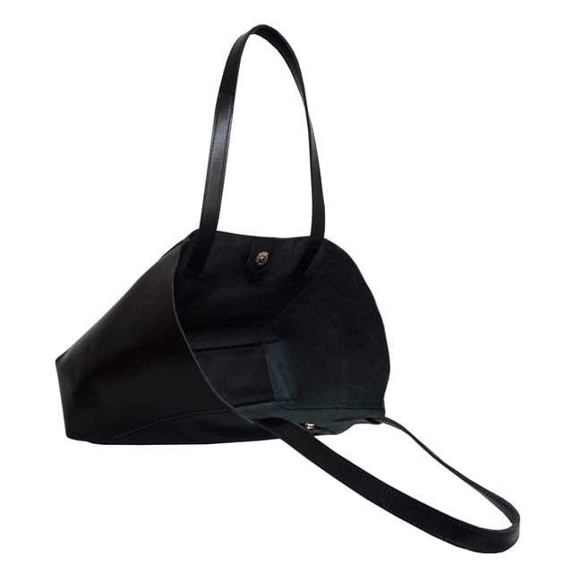 The 'Adela' genuine leather tote bag is beautifully handcrafted from premium Italian finish semi-soft and supple leather. Chosen for its durability, this timeless piece adds a touch of sophistication to all your outfits. Ideal for travel, meetings and everyday use, this chic handbag is a must-have addition to your collection of designer bags. Unlined for a robust and hard-wearing central compartment with an exposed, soft to the touch natural leather interior. Magnetic fastening closure opens to a roomy and spacious interior. Reinforced handle stitching to avoid snapping due to the load in the bag. Soft leather shoulder handles for a comfortable carry. Adorned with the inimitable Assots London clean finish gold embossed logo. Fittings colour: Shiny Gold. Composition: Body: 100% Genuine Leather. Lining: Unlined. DISCLAIMER : All pictures shown are for illustration purpose only. Actual product colour may vary due to different ambience lighting or the screen display settings.