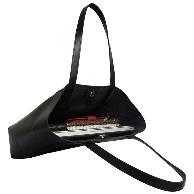The 'Adela' genuine leather tote bag is beautifully handcrafted from premium Italian finish semi-soft and supple leather. Chosen for its durability, this timeless piece adds a touch of sophistication to all your outfits. Ideal for travel, meetings and everyday use, this chic handbag is a must-have addition to your collection of designer bags. Unlined for a robust and hard-wearing central compartment with an exposed, soft to the touch natural leather interior. Magnetic fastening closure opens to a roomy and spacious interior. Reinforced handle stitching to avoid snapping due to the load in the bag. Soft leather shoulder handles for a comfortable carry. Adorned with the inimitable Assots London clean finish gold embossed logo. Fittings colour: Shiny Gold. Composition: Body: 100% Genuine Leather. Lining: Unlined. DISCLAIMER : All pictures shown are for illustration purpose only. Actual product colour may vary due to different ambience lighting or the screen display settings.
