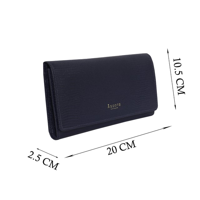 The ‘Claire’ flapover ladies purse is handcrafted with the premium lizard textured leather to give that designer look. Equipped with RFID technology, this practical ladies purse features a magnetic fastening closure with plenty of room to organise your cash, cards and coins. This large leather ladies purse is perfect to compliment your handbag and fits in easily. Stay safe and organised with ‘Claire’ the perfect addition to your collection of purses ideal for all outfits and occasions. Secured flap over magnetic fastening closure to store your essentials safely and securely. Foldover flap design. Equipped with RFID technology for safety. Additional back zip pocket to ensure you don’t run out of space. Two note compartments. Eight internal card compartments. Two windowed ID slots. Assots branded lined interiors. Lightweight for easy carry. Fittings Colour: Clean Brass. Composition: Body: 100% Genuine Leather. Lining: 100% Cotton. DISCLAIMER : All pictures shown are for illustration purpose only. Actual product colour may vary due to different ambience lighting or the screen display settings.