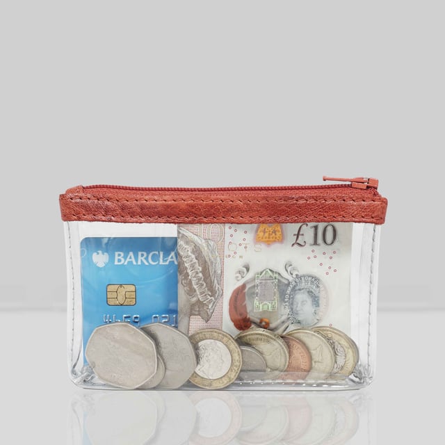 Size:13cm x 8.5cm x 2cm. The Dinah Transparent Zip Top Coin Purse is a unique handcrafted leather accessory that combines practicality with a fashionable twist. Its transparent design is sure to draw attention, while its compact size makes it an ideal accessory for any occasion. Composition:Body: Genuine Leather, PU transparent, Lining: Polyester.