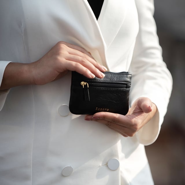 Keep things simple with this small coin purse crafted from super soft and supple natural grain Nappa leather. Featuring a simple compartment that opens along the top, the 'Mary' has a fully lined matching interior that is ideal for the basics. Comes in four more bright colours to spot easily in your bag. Zip top closure. Zip pocket at the front. Embellished with gold metal zippers and an inimitable Assots London golden foil embossed logo. Fittings: Gold Composition: Body: 100% Genuine Leather. Lining: 100% Polyester. DISCLAIMER : All pictures shown are for illustration purpose only. Actual product colour may vary due to different ambience lighting or the screen display settings.