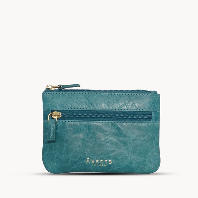 Keep things simple with this small coin purse crafted from super soft and supple natural grain Nappa leather. Featuring a simple compartment that opens along the top, the 'Mary' has a fully lined matching interior that is ideal for the basics. Comes in four more bright colours to spot easily in your bag. Zip top closure. Zip pocket at the front. Embellished with gold metal zippers and an inimitable Assots London golden foil embossed logo. Fittings: Gold Composition: Body: 100% Genuine Leather. Lining: 100% Polyester. DISCLAIMER : All pictures shown are for illustration purpose only. Actual product colour may vary due to different ambience lighting or the screen display settings.
