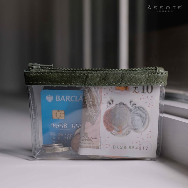 Size:13cm x 8.5cm x 2cm. The Dinah Transparent Zip Top Coin Purse is a unique handcrafted leather accessory that combines practicality with a fashionable twist. Its transparent design is sure to draw attention, while its compact size makes it an ideal accessory for any occasion. Composition:Body: Genuine Leather, PU transparent, Lining: Polyester.