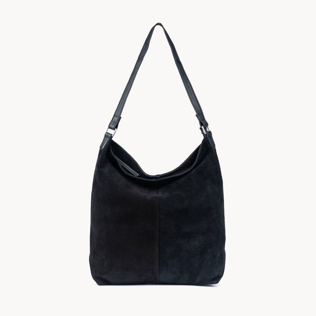 Size: 34cm x 35cm x 8cm. The ‘Tina’ designer slouchy tote bag is a refined statement of luxury and everyday versatility. Crafted from premium suede leather, it features a secure zip closure and a roomy, unlined interior, showcasing the authentic beauty of genuine leather. Thoughtfully designed for the modern professional, this timeless tote transitions effortlessly from business meetings to casual outings and evening events, offering a perfect combination of sophistication and practicality. Crafted from fine-napped suede leather for that slouchy look. Smooth zipper opens to a roomy unlined interior, offering both style and functionality. Extra-long full grain leather shoulder handles ensure a secure, slip-free fit, even over an overcoat. Internal secured zip pocket keeps your mobile phone, car keys, and house keys safe and accessible. Composition: Body - 100% Genuine Leather, Hardware -  Shiny Silver, Lining - Unlined.