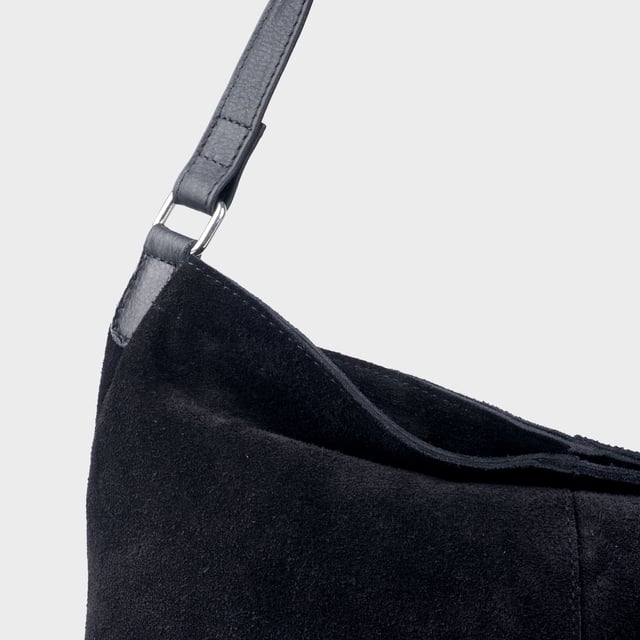 Size: 34cm x 35cm x 8cm. The ‘Tina’ designer slouchy tote bag is a refined statement of luxury and everyday versatility. Crafted from premium suede leather, it features a secure zip closure and a roomy, unlined interior, showcasing the authentic beauty of genuine leather. Thoughtfully designed for the modern professional, this timeless tote transitions effortlessly from business meetings to casual outings and evening events, offering a perfect combination of sophistication and practicality. Crafted from fine-napped suede leather for that slouchy look. Smooth zipper opens to a roomy unlined interior, offering both style and functionality. Extra-long full grain leather shoulder handles ensure a secure, slip-free fit, even over an overcoat. Internal secured zip pocket keeps your mobile phone, car keys, and house keys safe and accessible. Composition: Body - 100% Genuine Leather, Hardware -  Shiny Silver, Lining - Unlined.