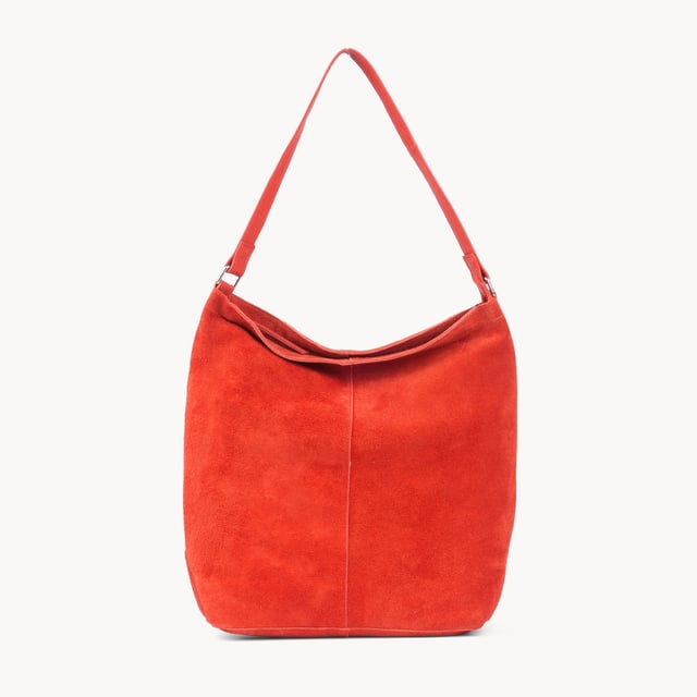 Size: 34cm x 35cm x 8cm. The ‘Tina’ designer slouchy tote bag is a refined statement of luxury and everyday versatility. Crafted from premium suede leather, it features a secure zip closure and a roomy, unlined interior, showcasing the authentic beauty of genuine leather. Thoughtfully designed for the modern professional, this timeless tote transitions effortlessly from business meetings to casual outings and evening events, offering a perfect combination of sophistication and practicality. Crafted from fine-napped suede leather for that slouchy look. Smooth zipper opens to a roomy unlined interior, offering both style and functionality. Extra-long full grain leather shoulder handles ensure a secure, slip-free fit, even over an overcoat. Internal secured zip pocket keeps your mobile phone, car keys, and house keys safe and accessible. Composition: Body - 100% Genuine Leather, Hardware -  Shiny Silver, Lining - Unlined.