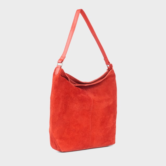 Size: 34cm x 35cm x 8cm. The ‘Tina’ designer slouchy tote bag is a refined statement of luxury and everyday versatility. Crafted from premium suede leather, it features a secure zip closure and a roomy, unlined interior, showcasing the authentic beauty of genuine leather. Thoughtfully designed for the modern professional, this timeless tote transitions effortlessly from business meetings to casual outings and evening events, offering a perfect combination of sophistication and practicality. Crafted from fine-napped suede leather for that slouchy look. Smooth zipper opens to a roomy unlined interior, offering both style and functionality. Extra-long full grain leather shoulder handles ensure a secure, slip-free fit, even over an overcoat. Internal secured zip pocket keeps your mobile phone, car keys, and house keys safe and accessible. Composition: Body - 100% Genuine Leather, Hardware -  Shiny Silver, Lining - Unlined.