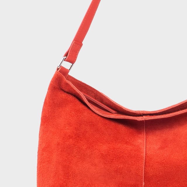 Size: 34cm x 35cm x 8cm. The ‘Tina’ designer slouchy tote bag is a refined statement of luxury and everyday versatility. Crafted from premium suede leather, it features a secure zip closure and a roomy, unlined interior, showcasing the authentic beauty of genuine leather. Thoughtfully designed for the modern professional, this timeless tote transitions effortlessly from business meetings to casual outings and evening events, offering a perfect combination of sophistication and practicality. Crafted from fine-napped suede leather for that slouchy look. Smooth zipper opens to a roomy unlined interior, offering both style and functionality. Extra-long full grain leather shoulder handles ensure a secure, slip-free fit, even over an overcoat. Internal secured zip pocket keeps your mobile phone, car keys, and house keys safe and accessible. Composition: Body - 100% Genuine Leather, Hardware -  Shiny Silver, Lining - Unlined.