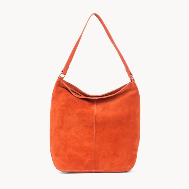 Size: 34cm x 35cm x 8cm. The ‘Tina’ designer slouchy tote bag is a refined statement of luxury and everyday versatility. Crafted from premium suede leather, it features a secure zip closure and a roomy, unlined interior, showcasing the authentic beauty of genuine leather. Thoughtfully designed for the modern professional, this timeless tote transitions effortlessly from business meetings to casual outings and evening events, offering a perfect combination of sophistication and practicality. Crafted from fine-napped suede leather for that slouchy look. Smooth zipper opens to a roomy unlined interior, offering both style and functionality. Extra-long full grain leather shoulder handles ensure a secure, slip-free fit, even over an overcoat. Internal secured zip pocket keeps your mobile phone, car keys, and house keys safe and accessible. Composition: Body - 100% Genuine Leather, Hardware -  Shiny Silver, Lining - Unlined.
