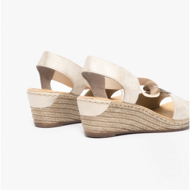 These women's wedge sandals feature a synthetic upper, textile lining, and RIRICON sole for comfort. Slip-on design with a round toe suits casual wear