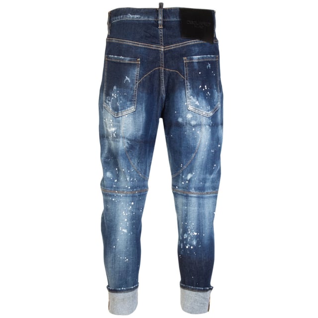 Elevate your wardrobe with the Dsquared2 Combat Jean in dark blue denim, crafted from a premium blend of 98% cotton and 2% elastane for exceptional comfort and durability. These men's jeans combine a classic navy blue shade with a modern combat-inspired design, offering both style and functionality. The slight stretch ensures a perfect fit that moves with you, making them ideal for everyday wear or casual outings. Experience the perfect balance of ruggedness and sophistication with these versatile jeans that effortlessly enhance any look