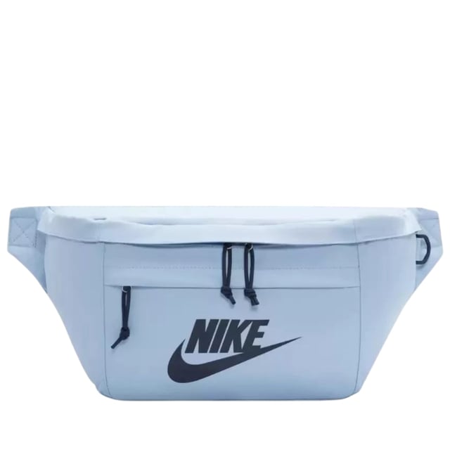 Nike Light Blue Crossover Bag The Nike Light Blue Crossover Bag combines style and practicality in one sleek design. Crafted from durable 100% polyester, this bag features a spacious 10-litre main compartment with a secure zip fastening, perfect for keeping your essentials safe on the go. The front zip pocket offers easy access to smaller items, while the large Nike Swoosh logo adds a bold, sporty touch. An adjustable strap with a buckle clip ensures a comfortable, customizable fit for all-day wear. Ideal for daily use, this lightweight crossover bag keeps your belongings organized and within reach wherever you head