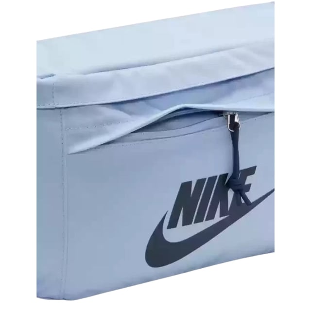 Nike Light Blue Crossover Bag The Nike Light Blue Crossover Bag combines style and practicality in one sleek design. Crafted from durable 100% polyester, this bag features a spacious 10-litre main compartment with a secure zip fastening, perfect for keeping your essentials safe on the go. The front zip pocket offers easy access to smaller items, while the large Nike Swoosh logo adds a bold, sporty touch. An adjustable strap with a buckle clip ensures a comfortable, customizable fit for all-day wear. Ideal for daily use, this lightweight crossover bag keeps your belongings organized and within reach wherever you head