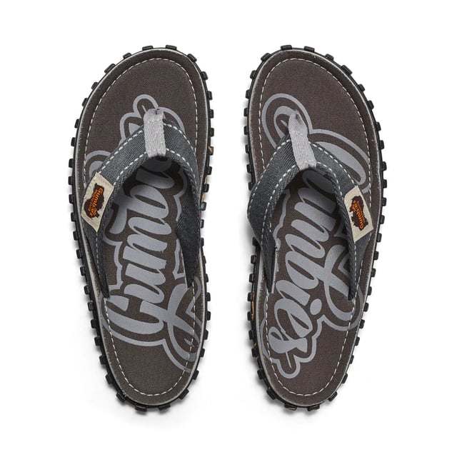 Unisex flip-flops made from recycled cotton canvas and rubber offer lightweight, breathable comfort with a slip-on design, round toe shape, and flat heel for casual wear