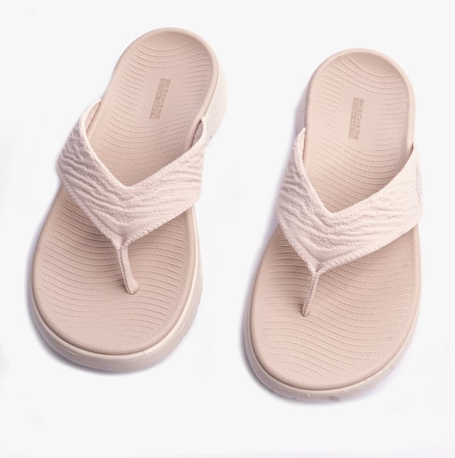 These slip-on women's sandals feature a textile upper and lining with a lightweight EVA sole, offering comfort and vegan-friendly design for casual wear