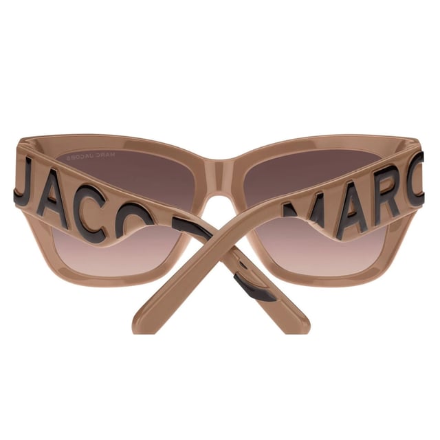 Elevate your eyewear collection with these Sunglasses, a perfect fusion of luxury and contemporary design. These sunglasses feature a sophisticated frame that complements any face shape, offering both style and comfort. Equipped with high-quality lenses, they provide excellent protection against harmful UV rays, ensuring your eyes stay safe during sunny days. Whether you're dressing up for a special occasion or adding a chic touch to your everyday look, these Marc Jacobs sunglasses deliver timeless elegance and reliable performance. Make a bold fashion statement while enjoying superior comfort and clarity. Made In Italy. Material 100% Acetate. Size 55/16/145. Sunglasses come with branded case and cleaning cloth