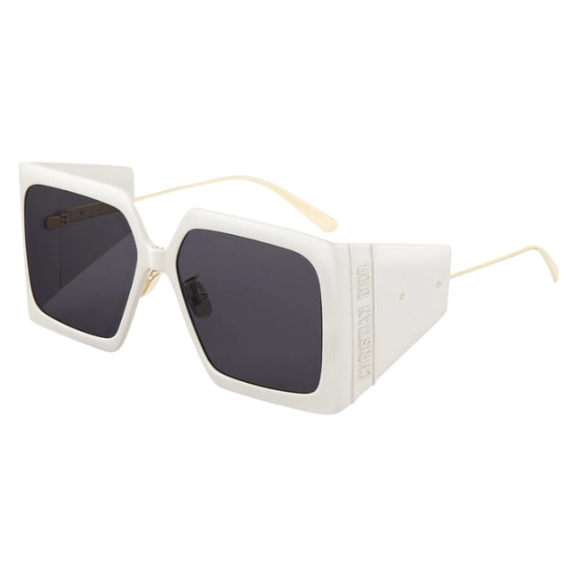 Dior Diorsolar Ivory Frame Dark Grey Lens Sunglasses Elevate your style with the Dior DiorSolar sunglasses, featuring a chic ivory frame paired with dark grey lenses. Designed for women who appreciate luxury and sophistication, these sunglasses offer both timeless elegance and superior eye protection. The sleek design complements any outfit, making them perfect for everyday wear or special occasions. Experience comfort and confidence while shielding your eyes from harmful rays with these high-quality Dior sunglasses. Make a bold fashion statement and enjoy lasting durability with this exquisite accessory. Made In Italy 100% Plastic