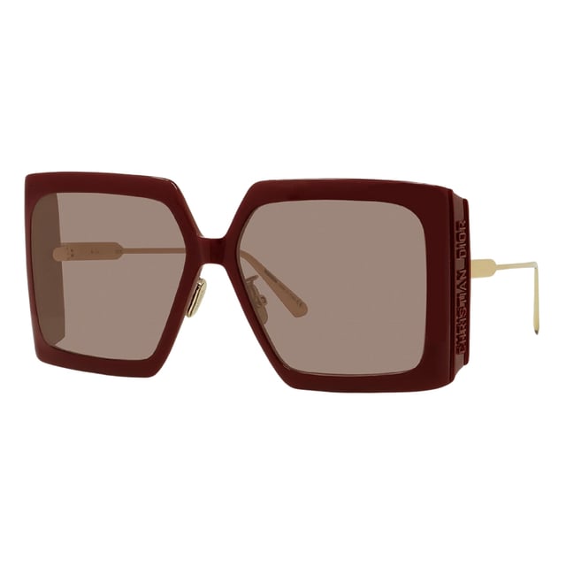 Elevate your style with the Dior DiorSolar sunglasses, featuring a rich burgundy frame paired with elegant Bordeaux lenses. Designed for women who appreciate luxury and sophistication, these sunglasses offer both striking aesthetics and reliable sun protection. The bold color combination enhances any outfit, making them perfect for daytime outings or special occasions. Crafted with Dior's signature attention to detail, these sunglasses provide a comfortable fit and timeless appeal, ensuring you look effortlessly chic while shielding your eyes from harmful rays. Make a statement with Dior's exquisite blend of fashion and function. Made In Italy 100% Plastic