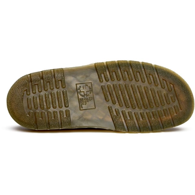The Dr Martens Josef brings the brand's rebellious DNA to warm-weather footwear with bold confidence. Crafted from rich black suede, these slides feature the iconic twin buckle design that's both functional and unmistakably DM. The signature AirWair sole delivers the comfort and durability you expect, while side-stitched construction ensures these sandals can handle whatever your summer throws at them.