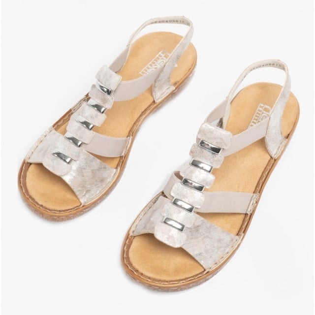 These synthetic women's sandals feature a cross-strap design with a round toe and flat heel, offering comfort for casual wear. They are lightweight and easy to fasten