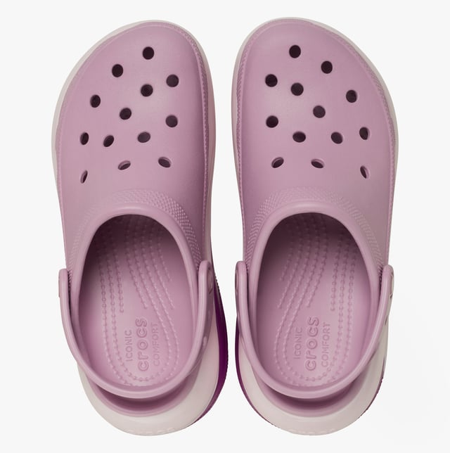These women's slip-on clogs feature Croslite material for comfort and breathability, a platform heel, and a round toe, ideal for casual wear and all-day comfort