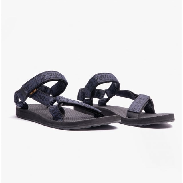 Teva Original Universal Mens Sandals Bandana Total Eclipse These lightweight, vegan open-toe sandals feature a polyester upper, rubber sole, and adjustable touch fasten for a comfortable casual fit
