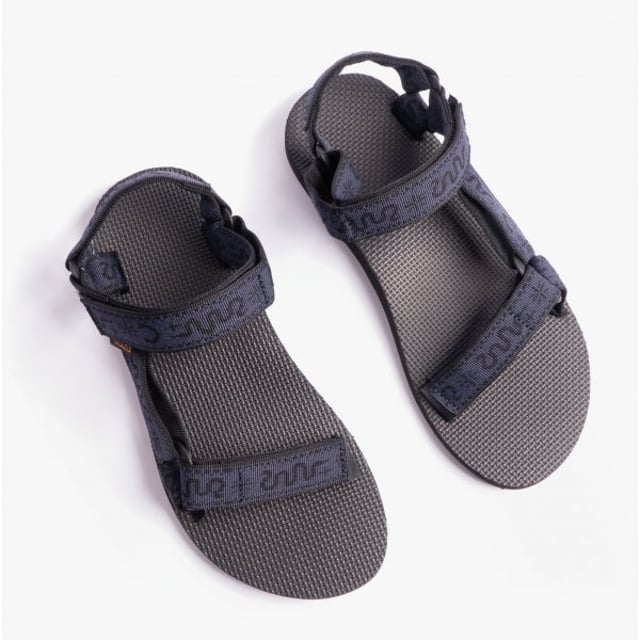 Teva Original Universal Mens Sandals Bandana Total Eclipse These lightweight, vegan open-toe sandals feature a polyester upper, rubber sole, and adjustable touch fasten for a comfortable casual fit