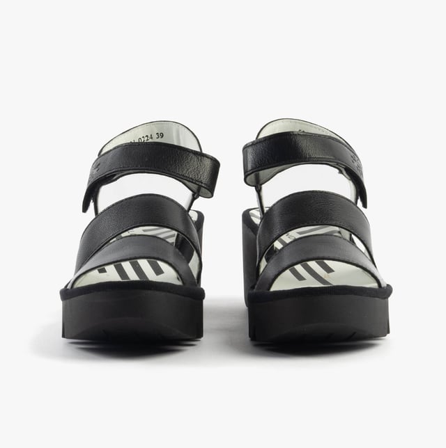 These open-toe wedge sandals feature a leather upper and lining with a rubber sole, offering comfort and breathability for casual wear