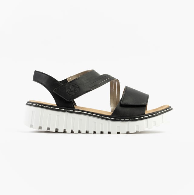 These women's open-toe wedge sandals feature a synthetic upper, breathable textile lining, and a RIRICON sole. Low heel height offers comfort for casual wear