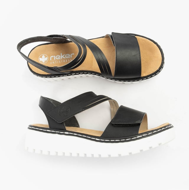 These women's open-toe wedge sandals feature a synthetic upper, breathable textile lining, and a RIRICON sole. Low heel height offers comfort for casual wear